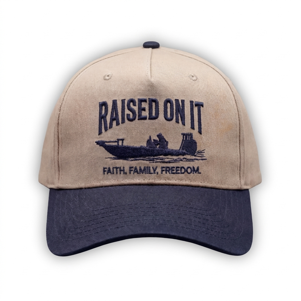 Outboard Legacy Hat in Skiff (navy brim, navy stitch) with embroidered Raised On It skiff logo and Faith Family Freedom